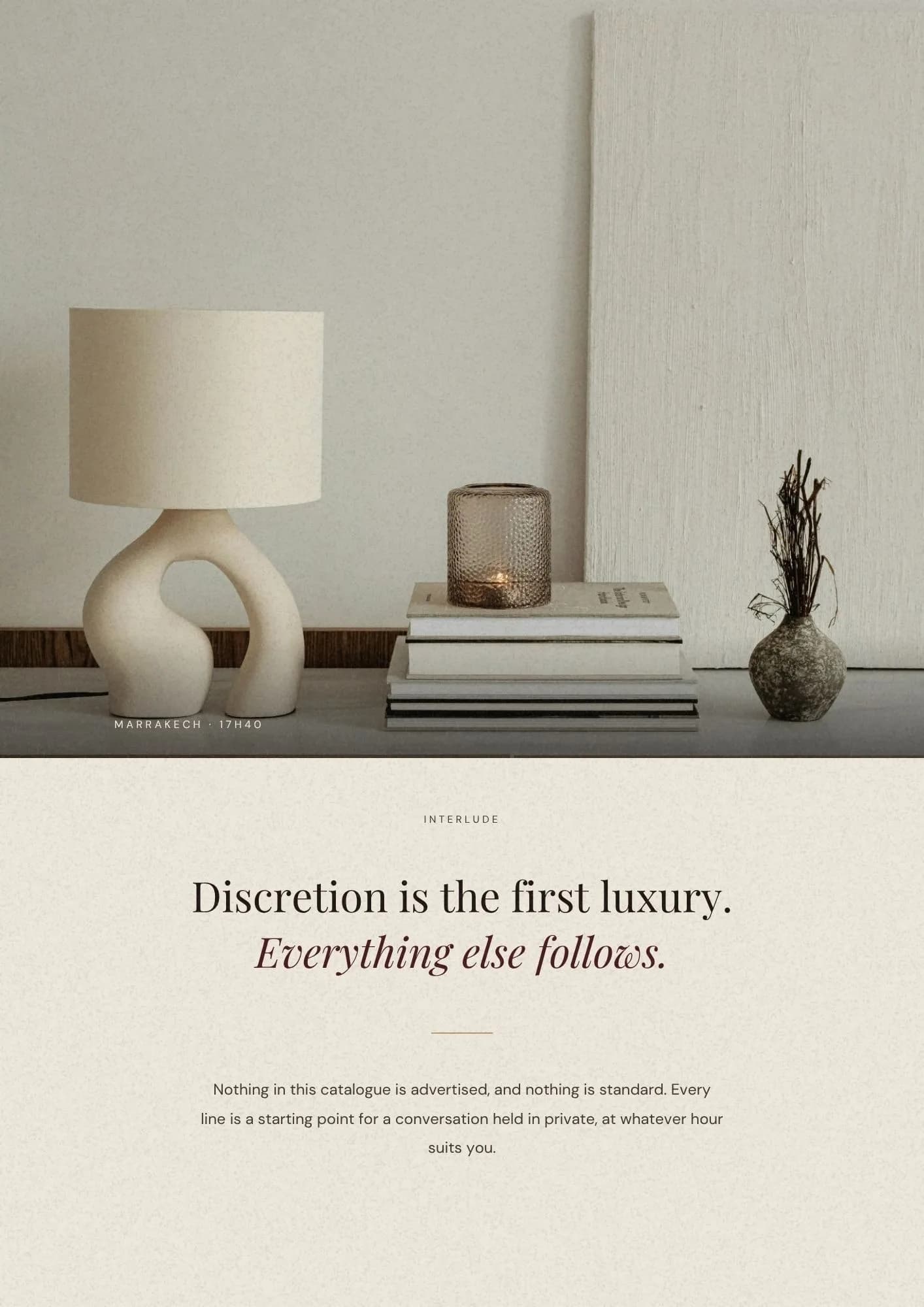 Interlude page. A still life of a lamp and books under the line Discretion is the first luxury.